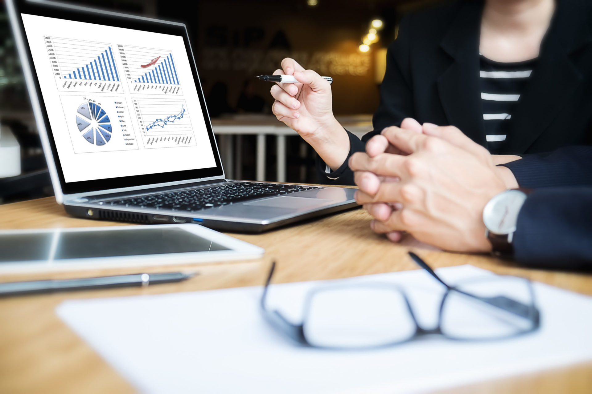 Business team meeting working with new startup project.discussion and analysis data the charts and graphs.Digital tablet laptop computer smart phone using,Business finances and accounting concept